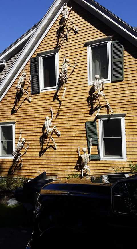 skeletons climbing on house